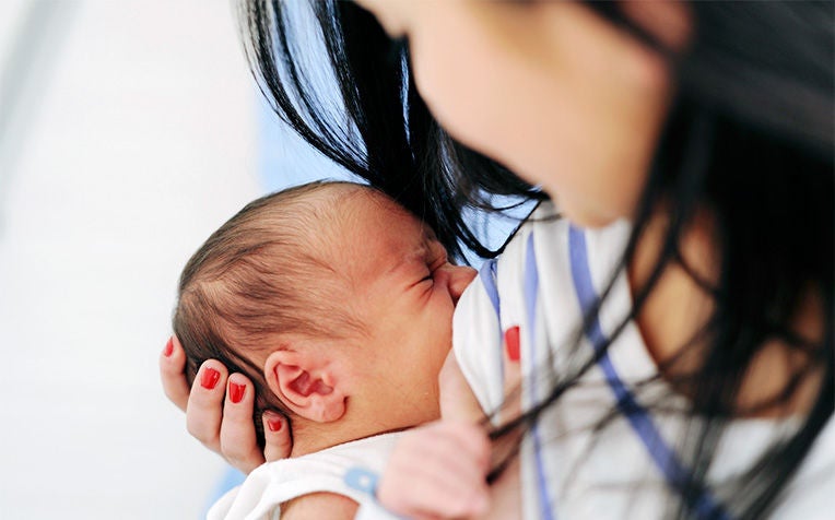 Proper breastfeeding positions can help your baby latch on efficiently and also prevent sore nipples and backache.
