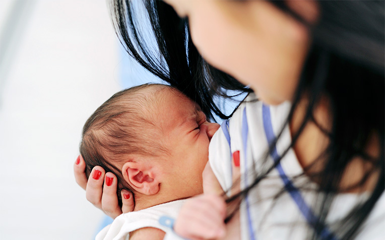 Proper breastfeeding positions can help your baby latch on efficiently and also prevent sore nipples and backache.