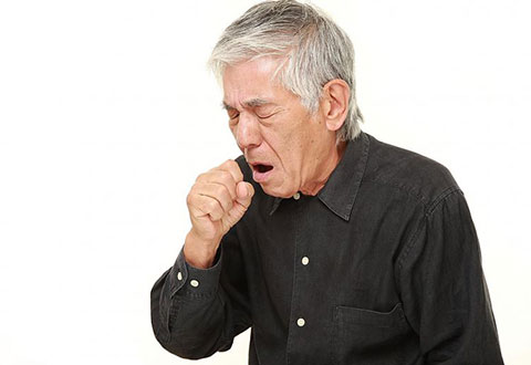 man coughing