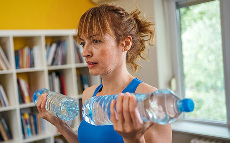 Workout at home using household items.